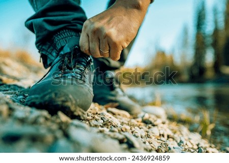 men's hiking shoes in the countryside, close up 