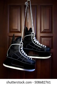 Men's Hockey Skates Hanging On The Wall