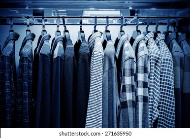 Mens Plaid Shirts On Hangers In A Retail Store