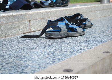 Men's Sandals Were Left On The Street. Begging And Vagrancy