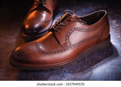Men's shoes, brown, on a dark background