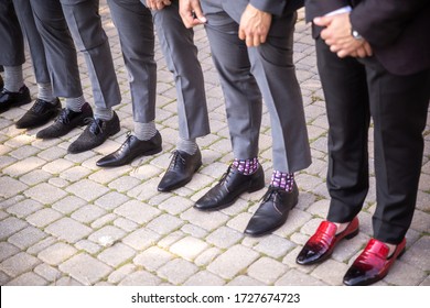 Mens Shoes And Socks Standing In A Row