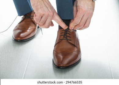 Men's shoes tying shoelaces.men wear wedding shoes - Powered by Shutterstock