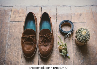 Mens Shoes With Wedding Accessories And Cactus On Wooden Floor