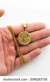 Mens Silver And Gold Jewellery With A White Background And Model Hands. High Quality Studio Photos Of Mens Chains.