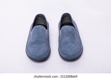 Men's Sky blue nubuck slip ons shoes on a white background - Shutterstock ID 2112008669