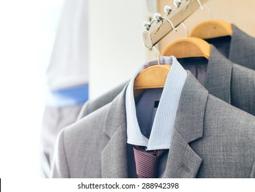 Mens Suits On Hangers In A Clothes Store