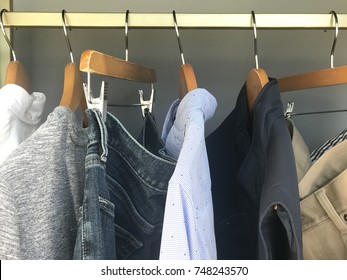 Mens Wardrobe Clothing Hanging On Rail In Closet