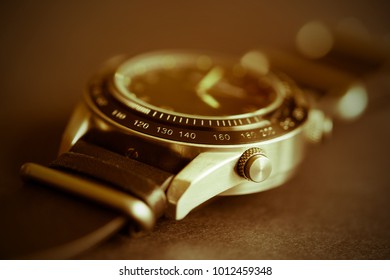 men's watch closeup with selective sharpness in the foreground and with photo effect