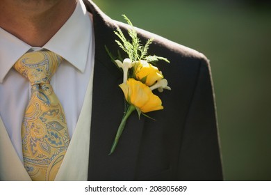 Men's wedding fashion, groom with yellow rose boutonniere 