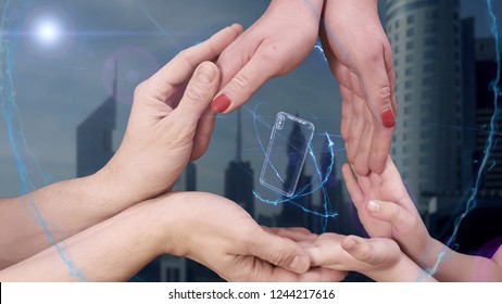 Men's, women's and children's hands show a hologram 3d smartphone. The family holds a magical inscription on the background of a modern city