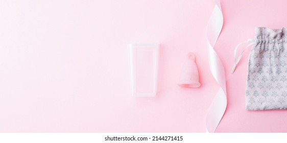 Menstrual cramp, use menstrual cup inside vagina. Pink ribbon with menstrual cup. Menstruation feminine period. Medical healthcare gynecological banner