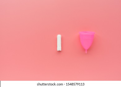 Menstrual Cup And Tampon On Pink Background. Alternative Feminine Hygiene Product During The Period. Women Health Concept. Copy Space. Eco Friendly Concept, Zero Waste Product. Flat Lay, Mockup