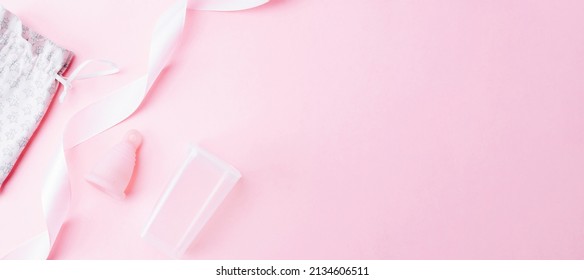 Menstrual cycle sanitary cup. Pink ribbon with menstrual cup. Menstruation feminine period. Sanitary hygiene banner. Use menstrual cup inside vagina