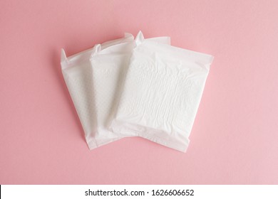 Menstruation Cycle, Feminine Hygiene And Protection, Sanitary Pads On Pastel Pink Background, Top View, Flat Layout