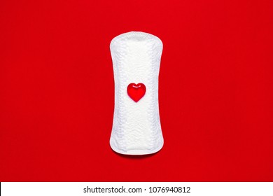 Menstruation. White Pad Liner With Symbol Of Blood On Red Background