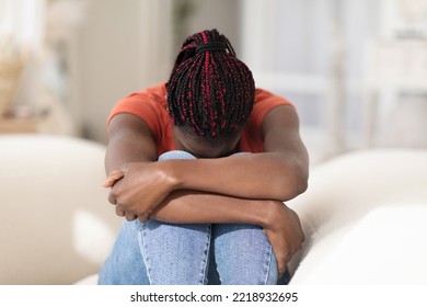 Mental Breakdown. Portrait Of Upset Young African American Woman Crying At Home, Depressed Black Female Burying Head In Knees While Sitting On Couch, Feeling Lonely And Sad, Copy Space