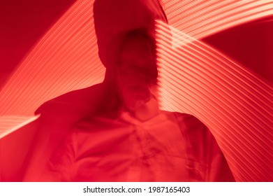 Mental Disorder Concept. Defocused Man In Red Light With Psycho Problems, Psychosis.