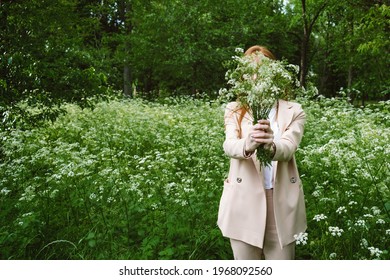 Mental Health Awareness Month, Behavioral Health Care. Post COVID-19 Pandemic Mental Health Challenges. Red-haired Young Woman On Green Nature Trees And Flowers Background