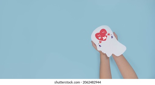 Mental Health, Brain Disorder Concept. World Mental Health Day, Alzheimer And Psychology Concept. Psycho Therapy Concept With Child Holding Paper Human Head