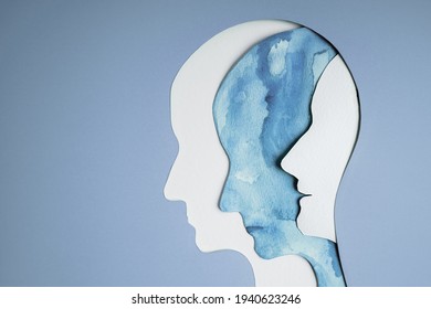 Mental Health Disorder Concept. Bipolar Disorder Person. Unstable Psycho. Layers of Paper Cut as Human Head presenting Different of Emotions. Happiness and Depression Emotion inside - Shutterstock ID 1940623246
