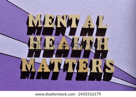 Mental Health Matters, words in wooden alphabet letters isolated on purple background as banner headline