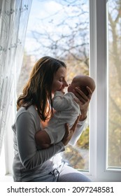 Mental Health In Postpartum Time. Maternal Mental Health. How To Avoid Pregnancy And Postpartum Disorders, Postpartum Baby Blues, Depression. Portrait Of Happy Mother And Newborn Baby