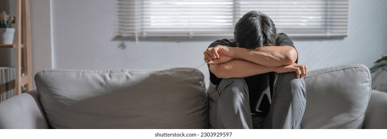 Mental health problem, Sad asian Male anxiety depressed lonely in his home. - Shutterstock ID 2303929597