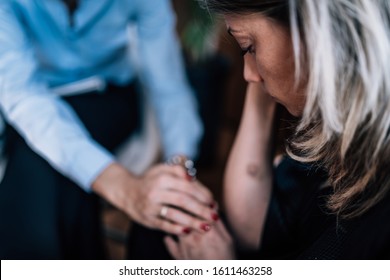 Mental Health - Psychotherapist Holding Patient’s Hand, Providing Support During Cognitive Behavioral Therapy Session