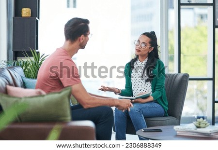 Mental health, therapy or counseling with a woman psychologist and male patient talking in her office. Psychology, wellness and trust with a female doctor or shrink consulting a man for healing
