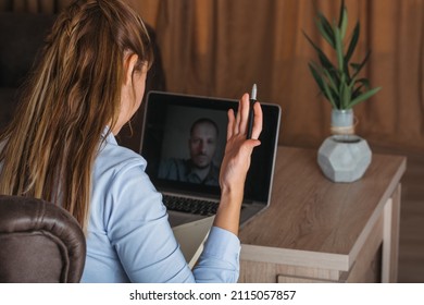 Mental Health Treatment Consultation. Smiling Female Psychologist Sits On The Armchair And Talks To A Patient During Remote Online Therapy Session.