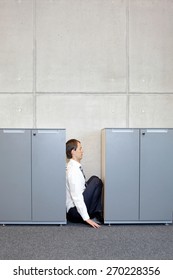 Mental Health - White Sad Business Man Crouching Between Cabinets