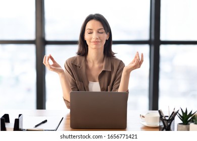 Mental Hygiene. Calm Beautiful Girl Meditating At Workplace, Dealing With Stress And Anxiety. Empty Space