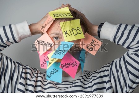Mental load concept - female has post-it notes with social responcibilities on her face