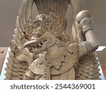 Menteng, Central Jakarta - October 12th, 2024: Beautiful and exotic Balinese style Garuda Woodcraft as Handcraft Heritage Cultural Arts at Modern Store Central Jakarta Indonesia