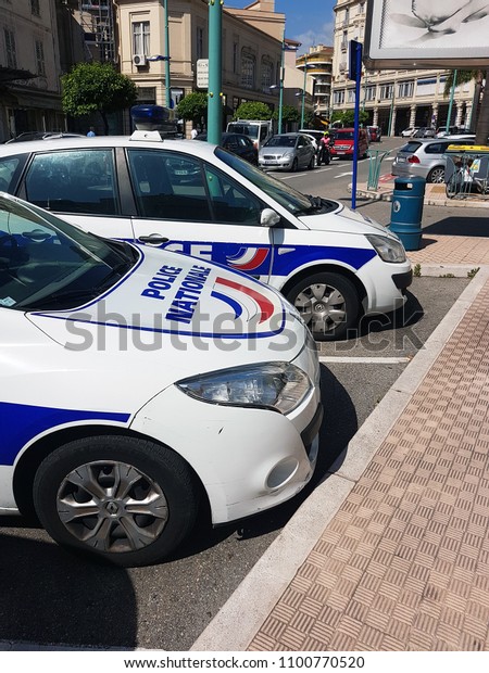 Menton, France - May 29, 2018: Two French Police\
Cars Parked in Front of the Police Station of Menton, French\
Riviera, Europe