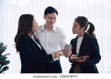 Mentor, manager advice younger colleagues in workplace. Businesspeople discussing or planning financial project strategy, talking together for harmony and strong teamwork in office concept. - Shutterstock ID 2280978971