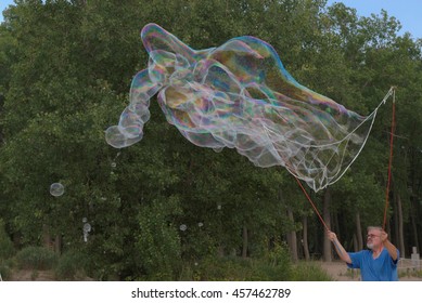 MENTOR OH USA - JULY 21 2016: Bubble Artist Creates Giant Bubbles To Entertain The Crowd At Beachfest.