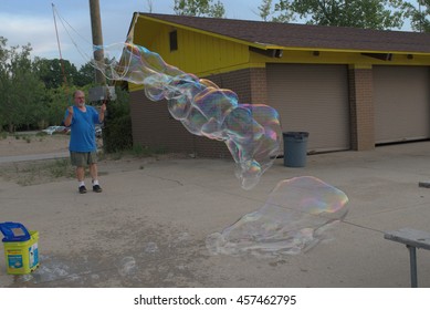 MENTOR OH USA - JULY 21 2016: Bubble Artist Creates Giant Bubbles To Entertain The Crowd At Beachfest.