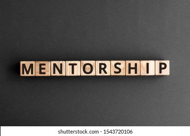 Mentorship - Word From Wooden Blocks With Letters, Mentoring Mentorship Concept,  Top View On Grey Background