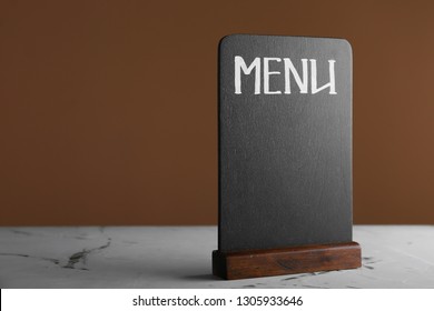 Menu board on grey table
