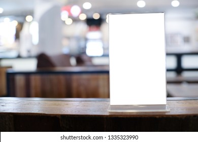 Menu frame space for text marketing promotion standing on wood table in Bar restaurant cafe - Shutterstock ID 1335323990