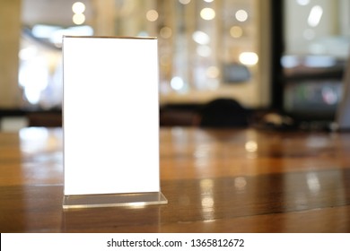 Menu frame space for text marketing promotion standing on wood table in Bar restaurant cafe - Shutterstock ID 1365812672