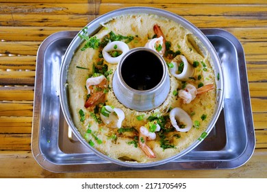 A Menu Fusion Food Of Seafood Mixed In Egg Custard In A Hot Pot On Aluminum Tray On Bamboo Table With Top View.Creativity Customization To Make It Interesting And Enjoyable To Eat.