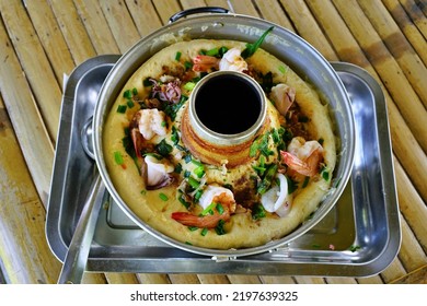 A Menu Fusion Food Of Seafood Mixed In Egg Custard In A Hot Pot On Aluminum Tray On Bamboo Table With Top View.Creativity Customization To Make It Interesting And Enjoyable To Eat.