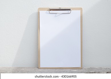 Menu Mockup On Clipboard And Sunlight On A Wall.