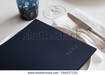 Menu on a table set in a restaurant