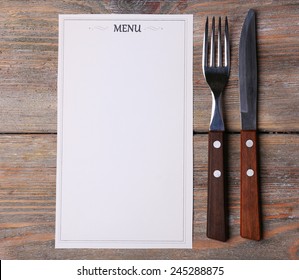 Menu Sheet Of Paper On Rustic Wooden Surface Background