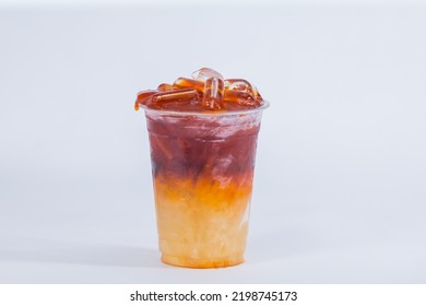 Menu Thai Honey Tea, Honey Tea served with a sixteen ounce plastic cup, white background.