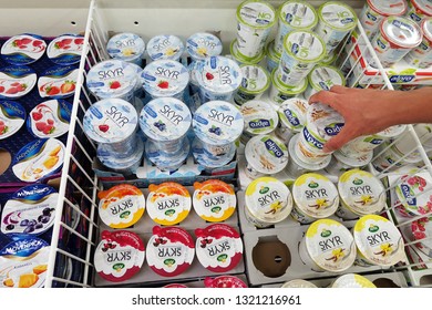 MEPPEN, GERMANY - AUGUST 21, 2018: Various dessert cups in the cooler of a Kaufland hypermarket. Skyr is a traditionally Icelandic cultured dairy product                               